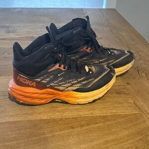 Hoka Black and Orange Trail Runners